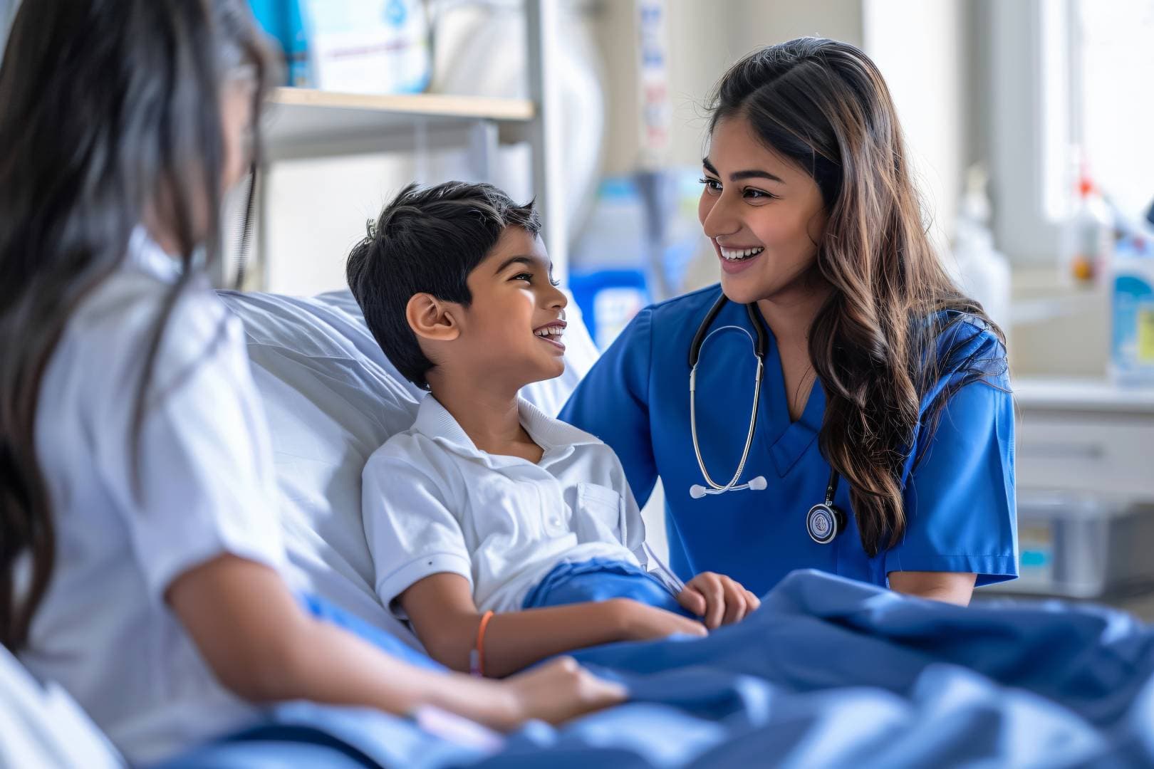 A doctor is sitting besides small child with face full of smiles and child is also  giving a subtle smile. The doctor and patient are looking at each other.